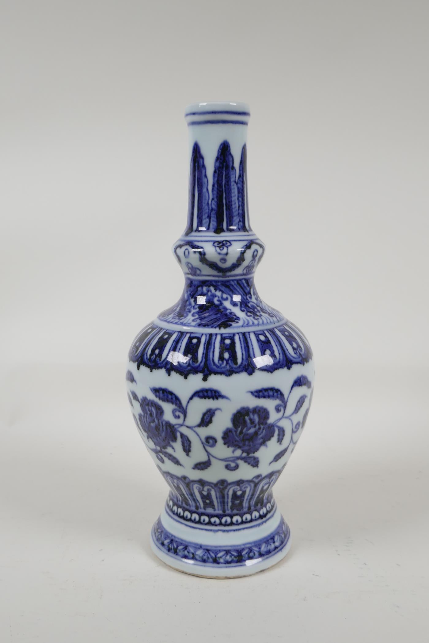 A Chinese blue and white porcelain vase with scrolling floral decoration, 6 character mark to - Image 2 of 4