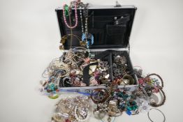 A quantity of costume jewellery in an aluminium brief case