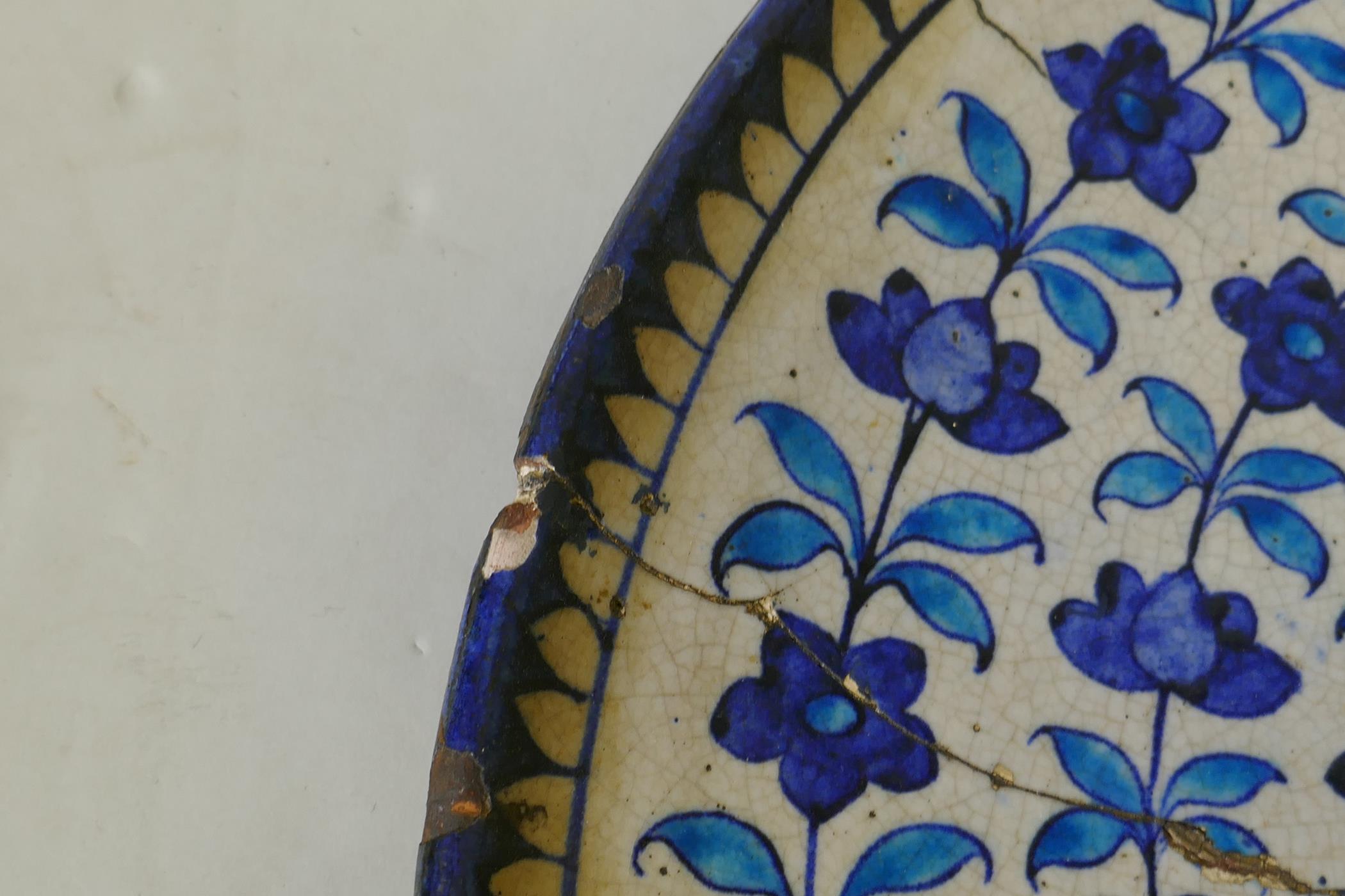 Antique middle Eastern glazed terracotta charger with Iznik style decoration, A/F, 18" diameter - Image 3 of 4