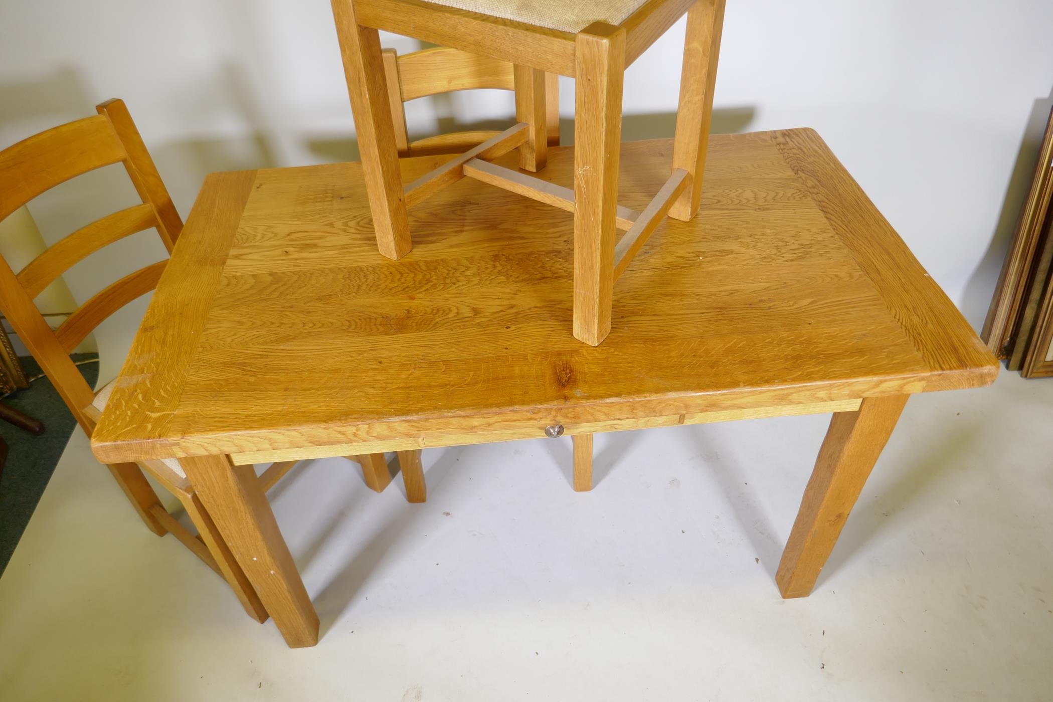 A blond oak kitchen table with single drawer and three matching ladder back dining chairs, 51½" x - Image 3 of 3