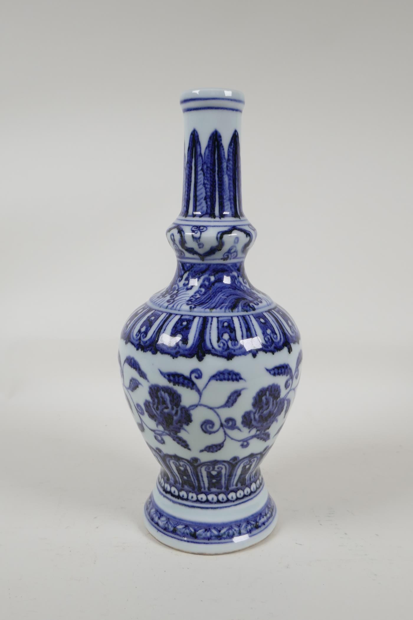 A Chinese blue and white porcelain vase with scrolling floral decoration, 6 character mark to - Image 3 of 4