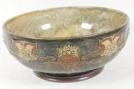 A Royal Doulton stoneware fruit bowl with embossed garland design on a green glaze, 9½" diameter