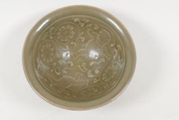 A Chinese Song style olive celadon bowl embossed with children and flowers, 4" diameter