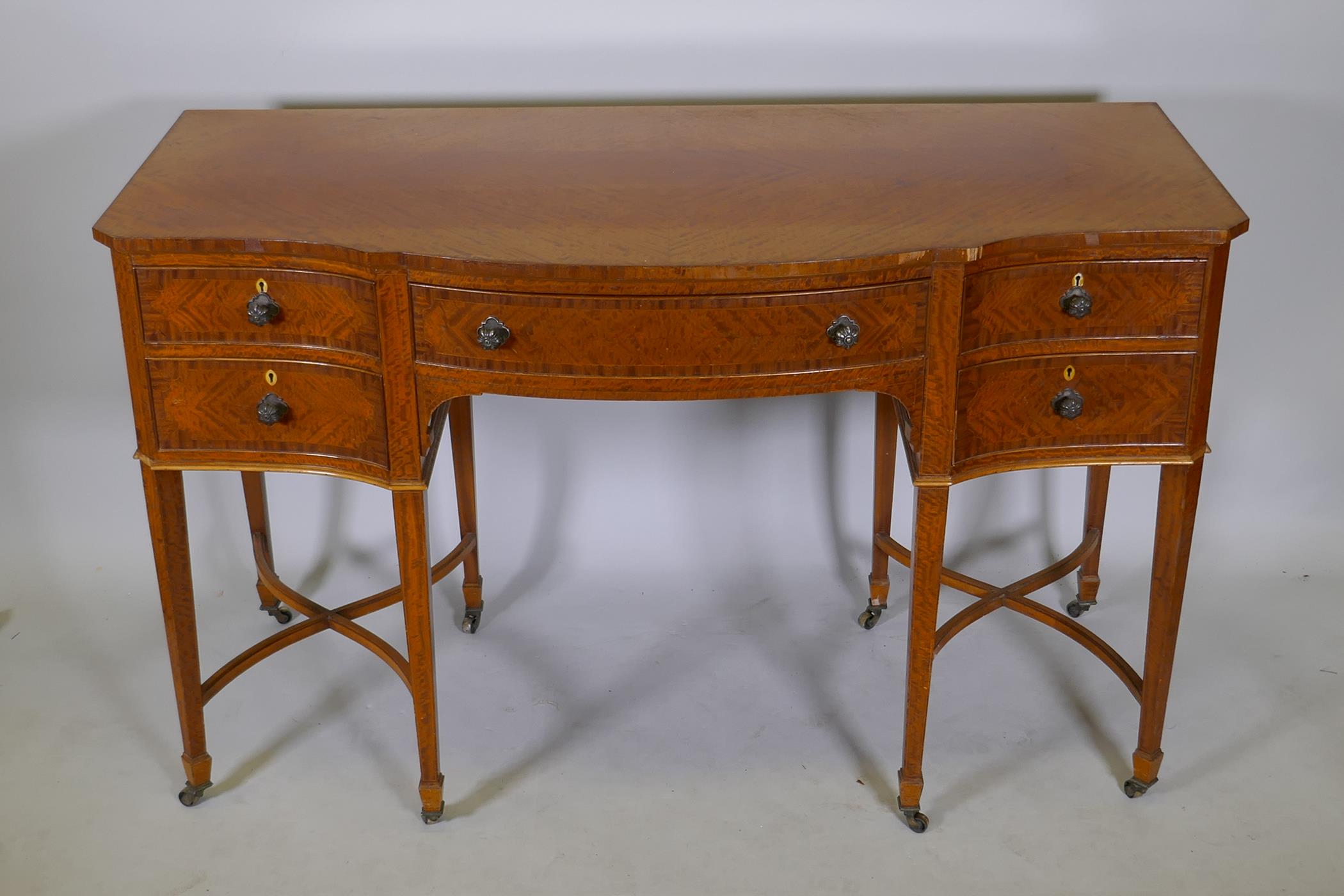 A C19th satinwood five drawer kneehole desk, with serpentine front and canted corners, raised on - Image 2 of 3