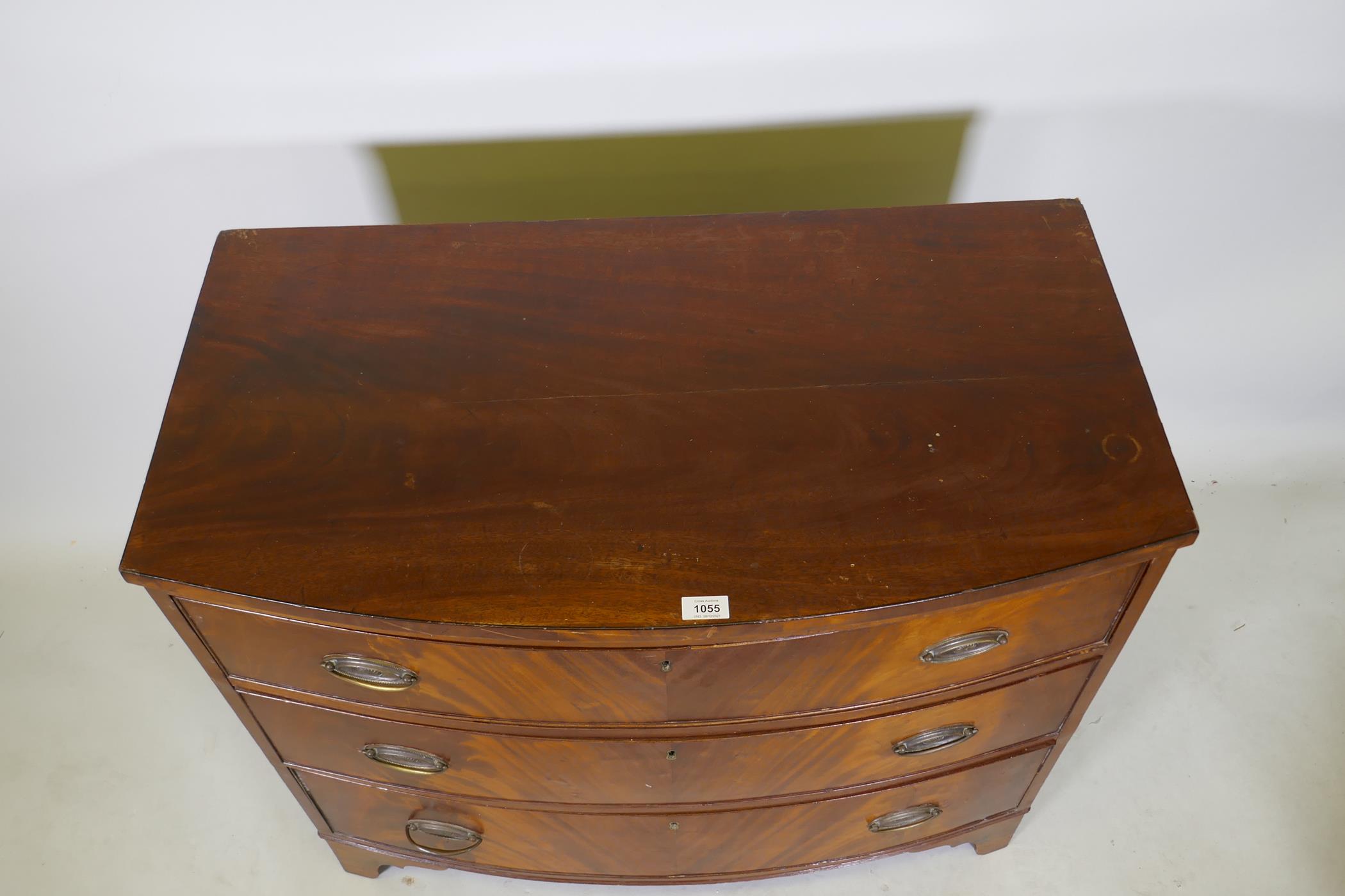 A Victorian figured mahogany bow front chest of drawers, raised on bracket feet, 37" x 20", 31" high - Image 2 of 2