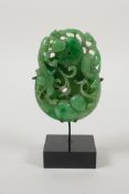 A Chinese apple jade carving of kylin, gourds and a pi disc, mounted on a display stand, 5" high