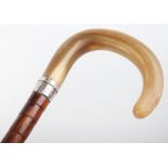 A fine 19th century malacca walking stick with silver band and horn handle