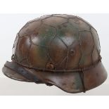 German M40 Normandy cammouflaged steel helmet