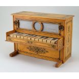 A Victorian child’s miniature wooden upright toy piano, German,