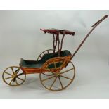 A Victorian painted wooden dolls carriage,