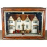 A charming model cottage in glass case, English 1906,