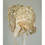 A beautiful ivory silk baby bonnet, late nineteenth century,