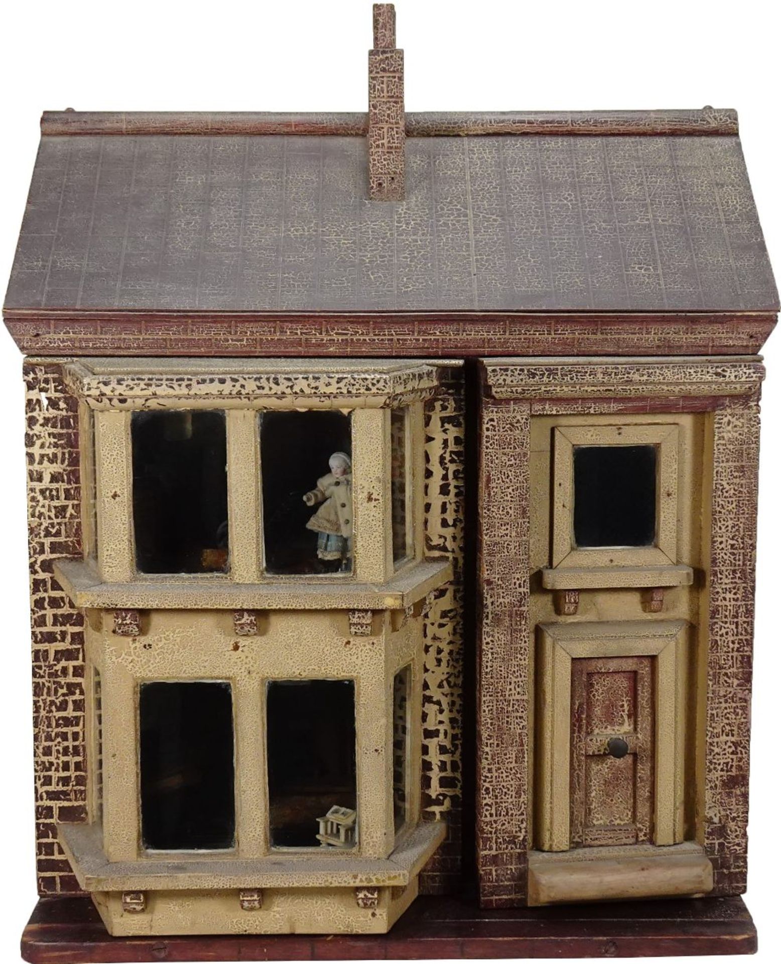 A traditional painted wooden dolls house, made by F.H.Crowe, Newmarket probably 1920s,