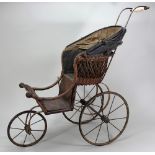 A Victorian sprung dolls pram, English,