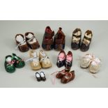 A collection of nine pairs of doll shoes,