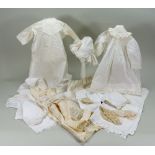 A selection of antique white cotton dolls clothes,