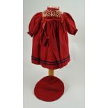 A red wool dolls dress and beret, German circa 1890,