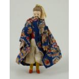 A rare miniature painted wood china man doll, German circa 1830,