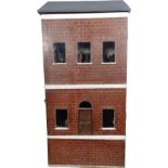 A wooden painted Victorian Dolls House and Milliners Shop,