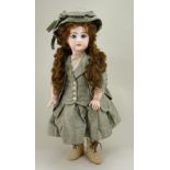 A reproduction Tete Jumeau bisque head doll by Carol Stanton, 1988,