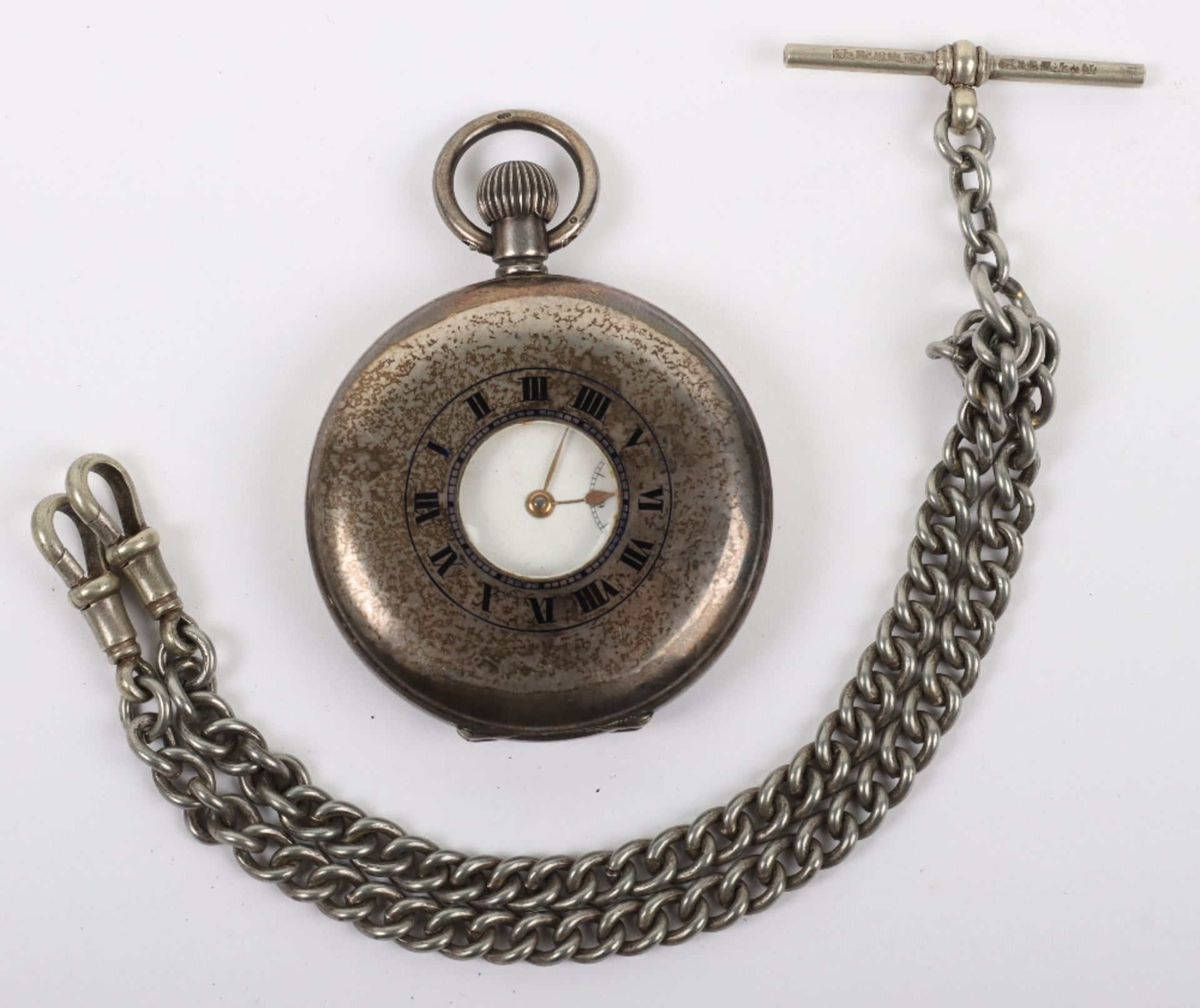A silver half hunter pocket watch and chain