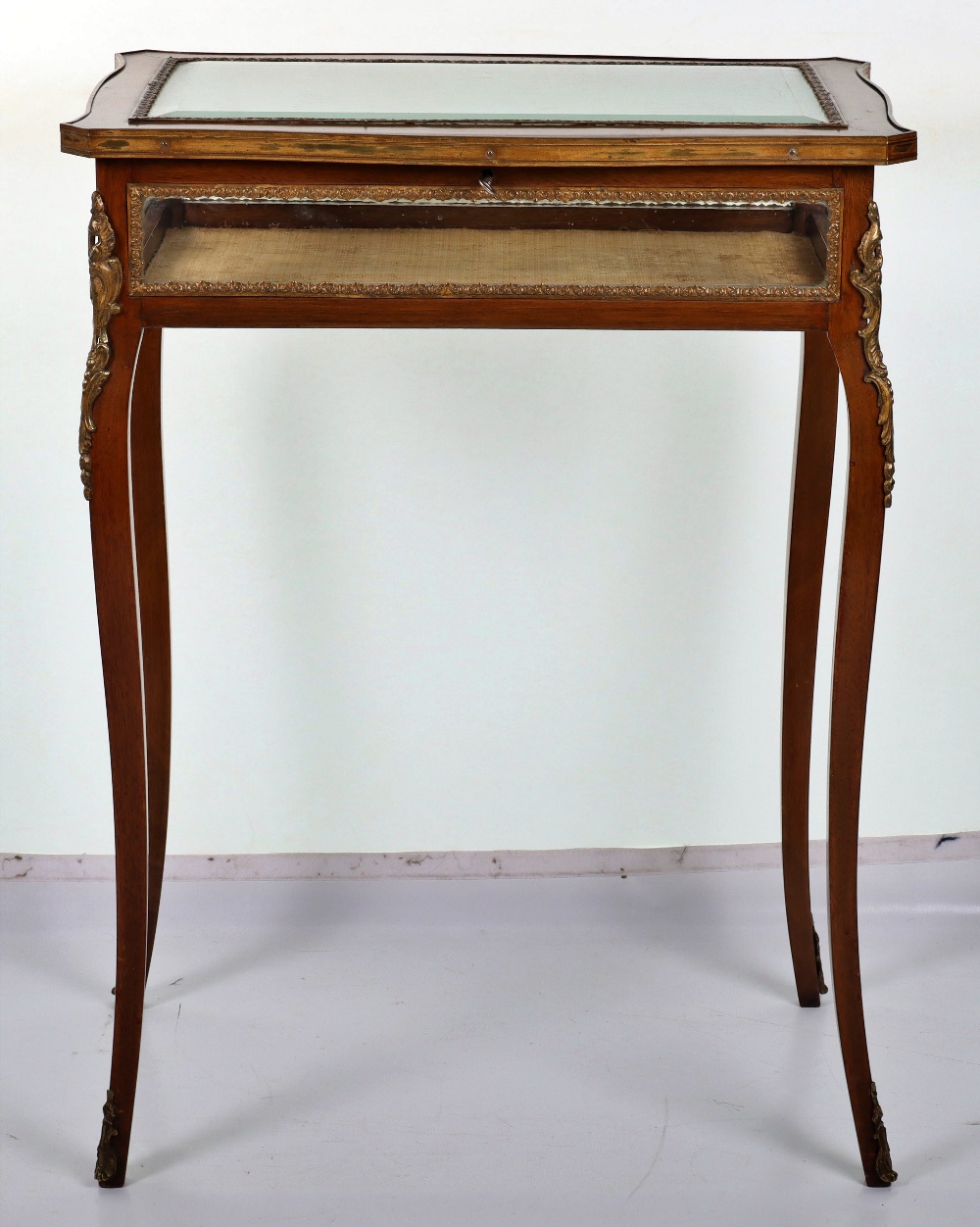A French mahogany serpentine Bijouterie table in Louis XV style, probably late 19th century