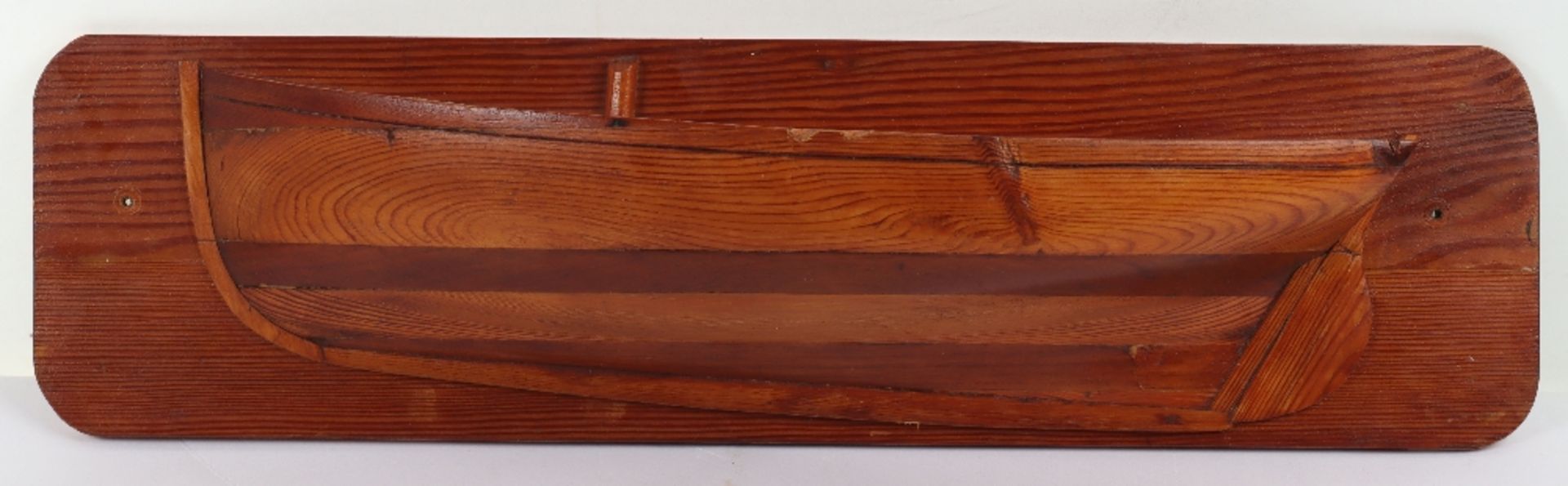 A 19th century pitch pine and beech wall mounted half block model of a boat, ‘Falmouth Oyster Dredge