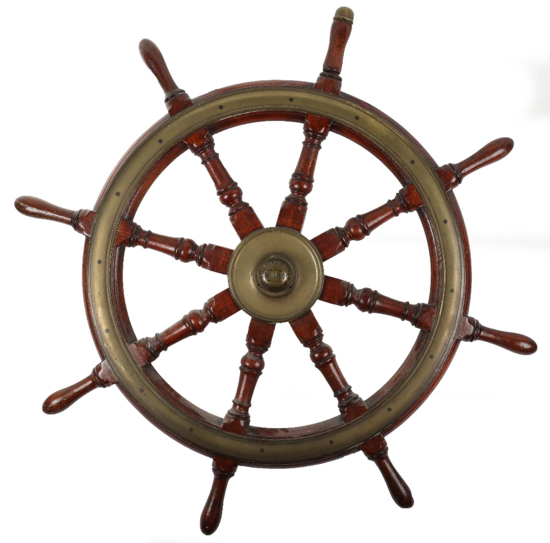 An early 20th century oak and brass ships wheel