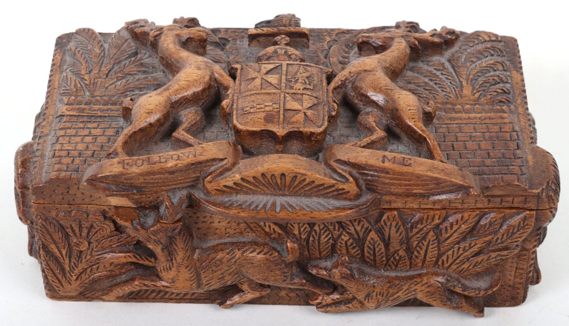 A 19th century Scottish carved wood box with Campbell clan crest and motto to lid