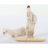 >A 19th century Japanese ivory bean, a Okimono of an elder and an Inuit carved bone polar bear