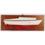 A 20th century wall mounted half model of a boat