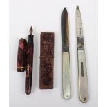 Two silver and mother of pearl fruit knives, with a 14ct nib Burnham fountain pen