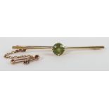 A 15ct gold and peridot set brooch