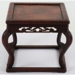 A 19th century small Chinese hardwood carved candle stand