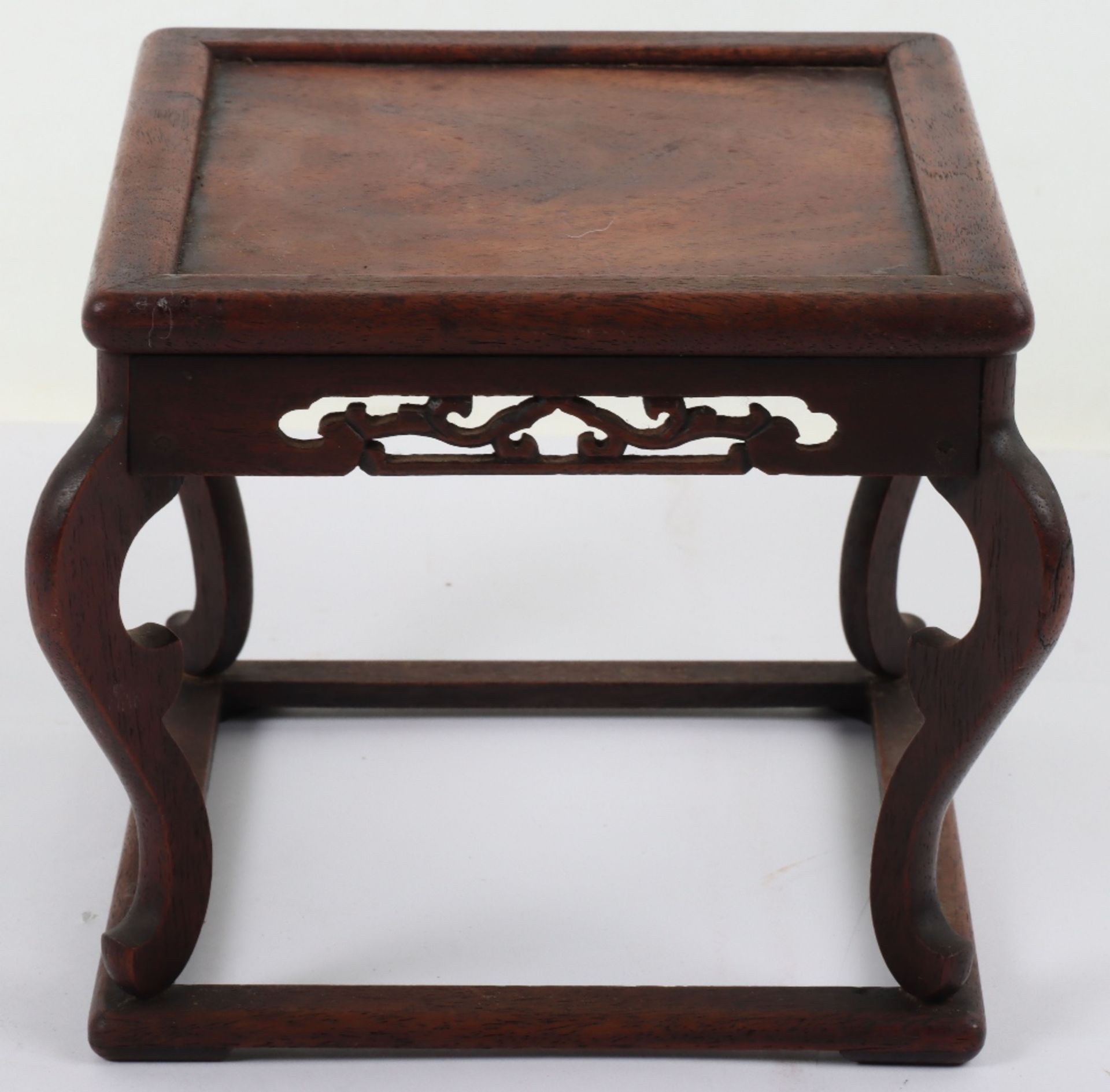 A 19th century small Chinese hardwood carved candle stand