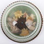 A charming rock crystal paperweight with nesting birds within