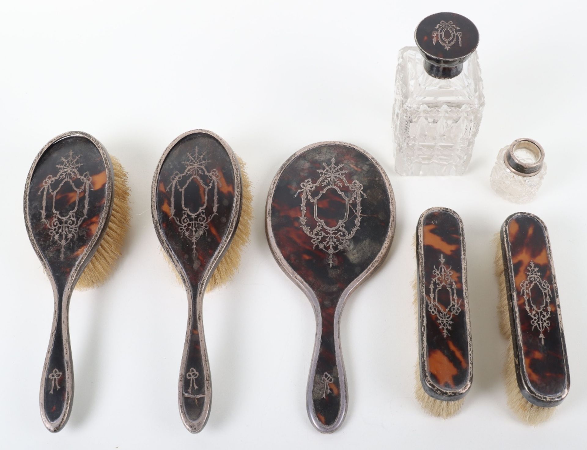 An early 20th century silver, tortoiseshell and pique work dressing table set, Charles Henry Dumenii