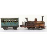 A rare C.R (Rossignol) tinplate 0-6-0 clockwork floor train ‘Ouest’ and passenger coach