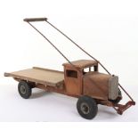 A Tri-ang wooden pull-along flat back wagon, English 1930s,