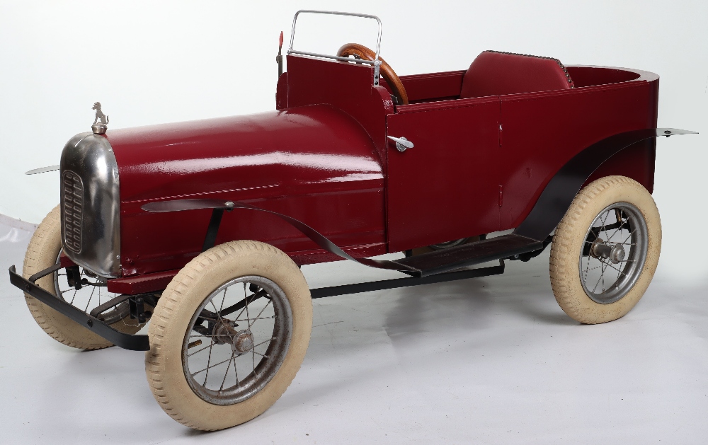 A large scratch built wooden and metal two seater child’s pedal car