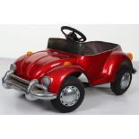 A pressed steel child’s VW Beetle pedal car, probably English circa 1970
