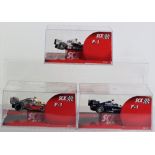 Three Boxed SCX F1 Model Slot Cars