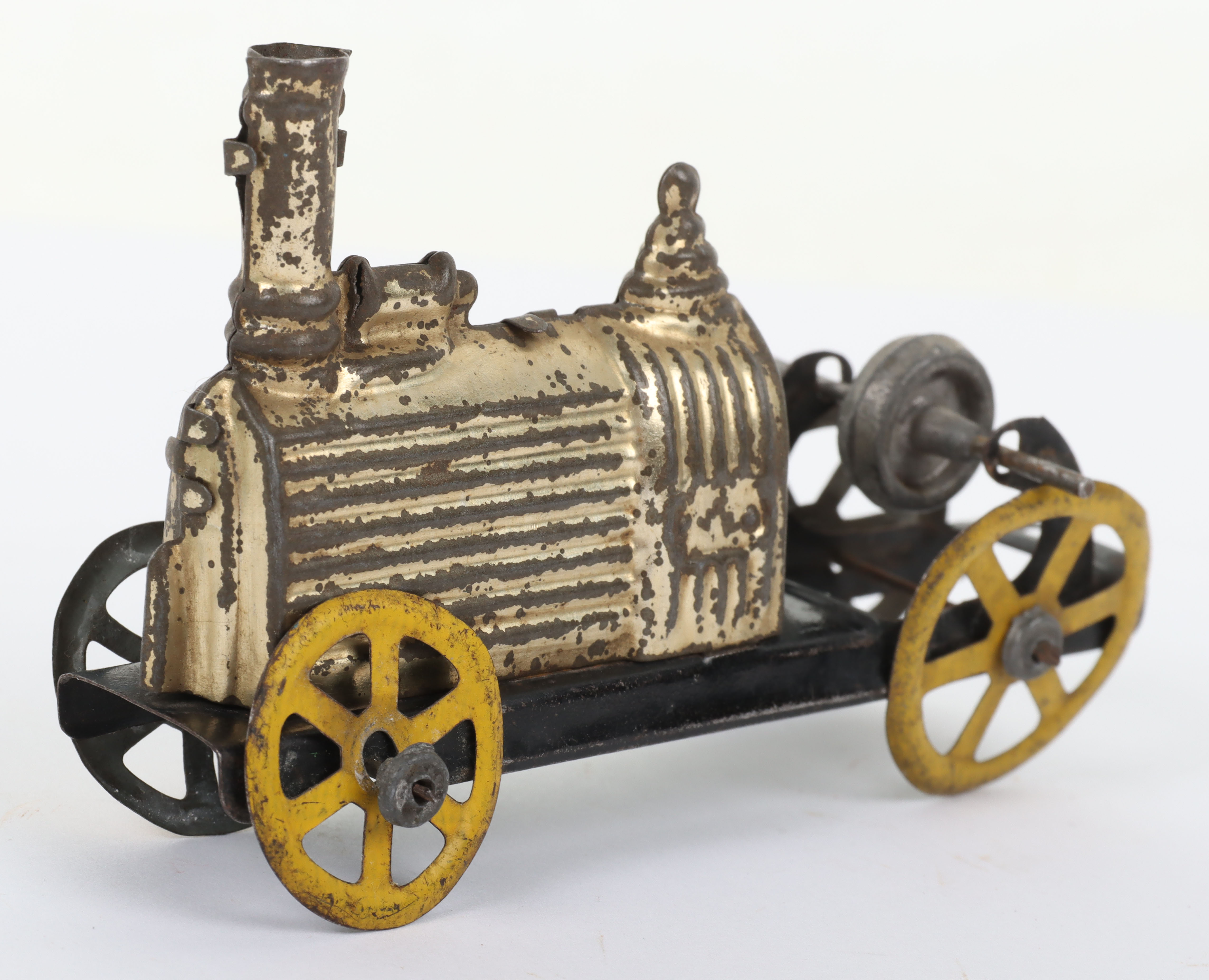 A C.R (Rossignol) pressed tinplate friction driven penny toy of an early locomotive, French circa 19