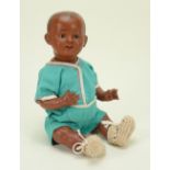 A rare Franz Schmidt & Co 1272 mulatto bisque head character baby doll, German circa 1910,