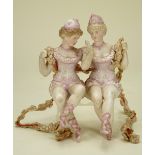 A pair of bisque figurines on swing, German circa 1910,