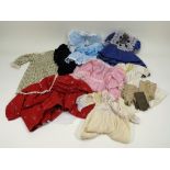 A collection of doll and children’s clothing,