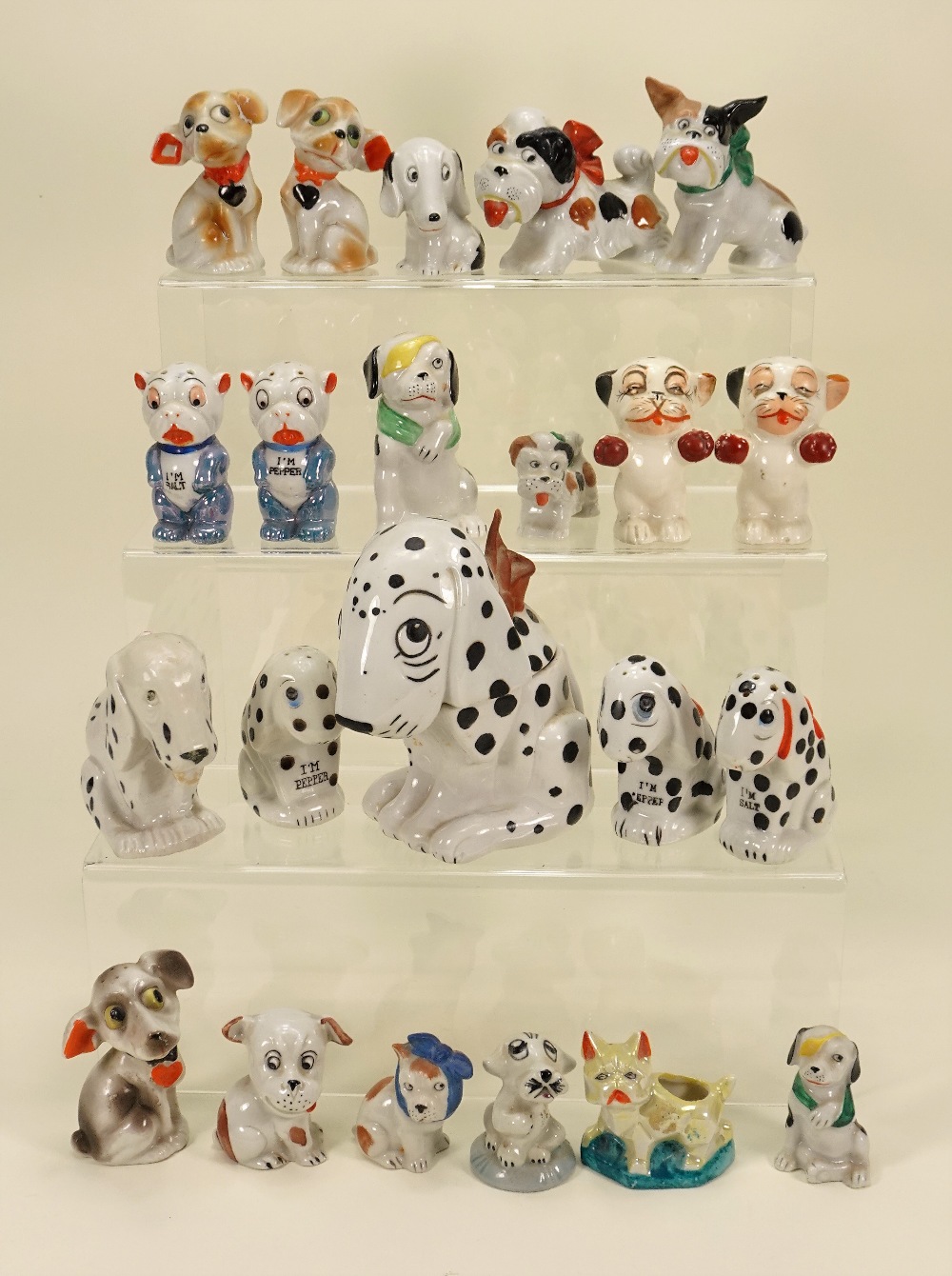 Collection of Dismal Desmond and other glazed china dog figurines,