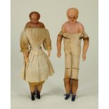 Two Early bees wax shoulder head dolls, English circa 1850,