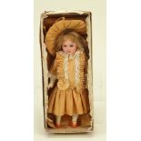 A small Herm Steiner bisque head doll in original card box, German circa 1905,