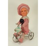 A rare Dean’s rag Book A1 Doll (Buster Brown) on Trike cloth doll, circa 1930,